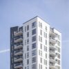 Vertical shot of a white building under the clear sky appartement Belvédère